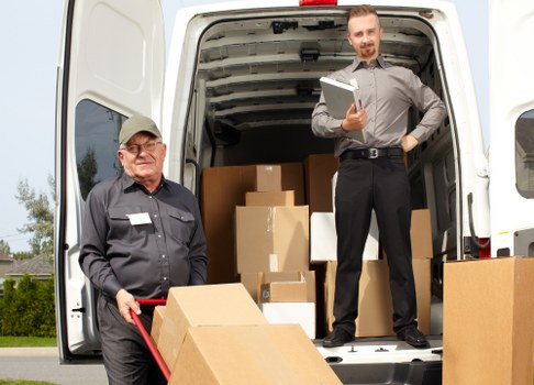 Professional flat removals in Hackney with moving van and boxes