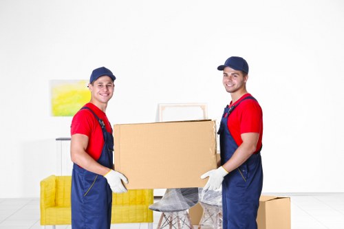 Students preparing for removals in Hackney with packed boxes