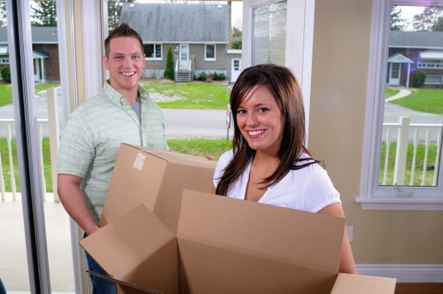 House removalists in Hackney loading furniture into a moving van