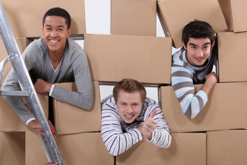 Professional house removal team handling furniture during a Hackney relocation