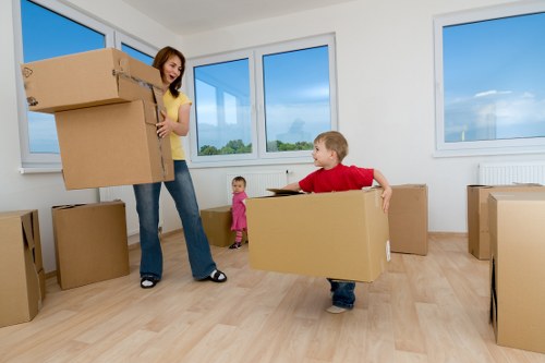 Team using safe lifting techniques during a removal job