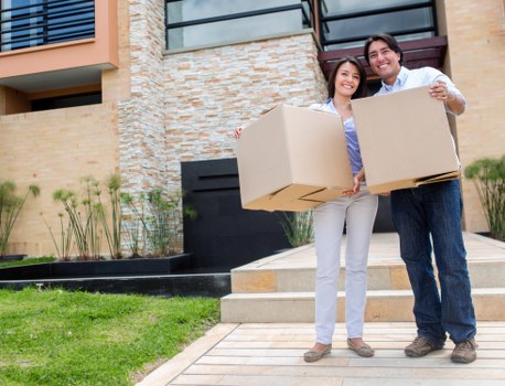 Moving professionals handling furniture during an office relocation in Hackney